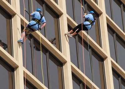 two people grappling down the building